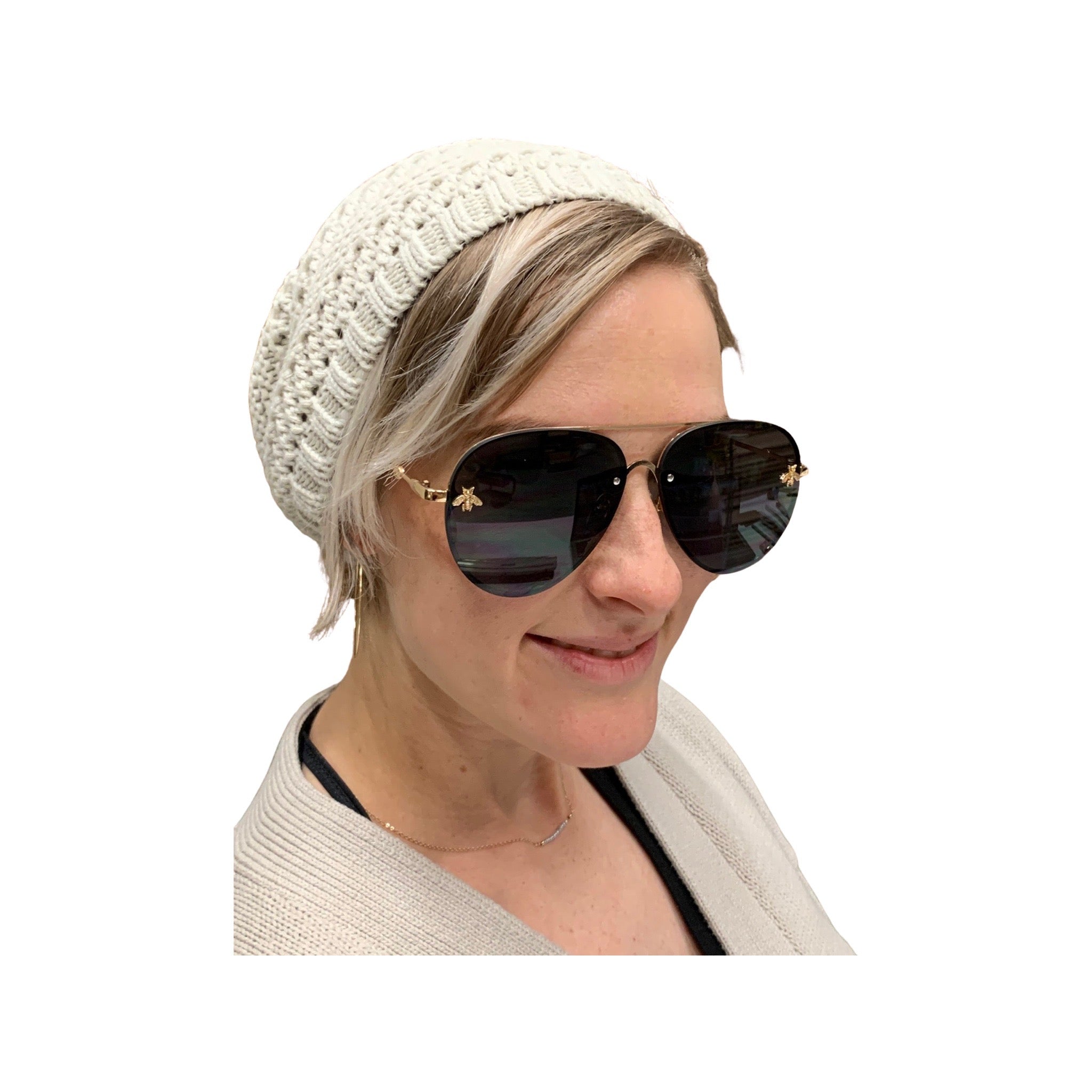 Stylish aviator sunglasses for women with a gold bee embellishment.